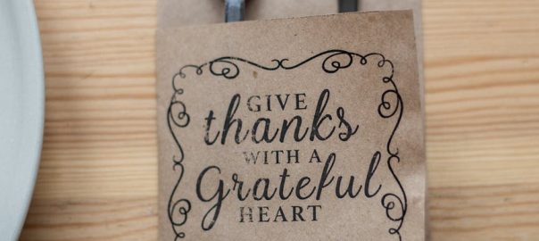 fork and knife in paper cover with inscription