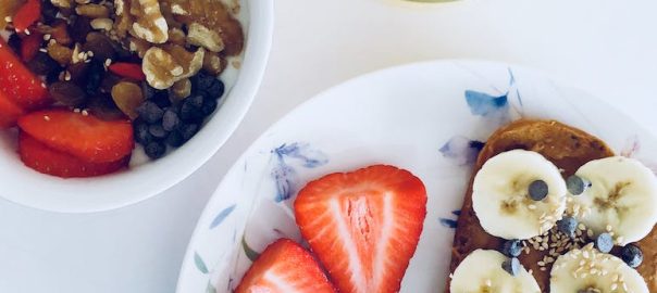 flatlay photography of bread and fruits